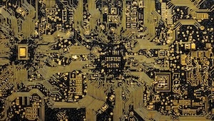 close-up-of-a-circuit-board-showing-intricate-gold-pathways