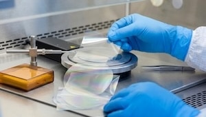 gloved-hands-handling-thin-film